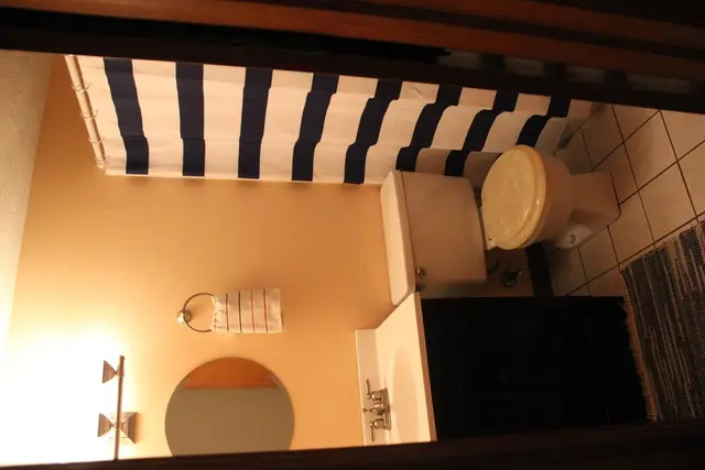 Hallway bathroom with bathtub