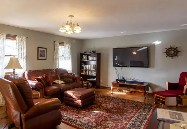Second-floor living room with 60-inch TV